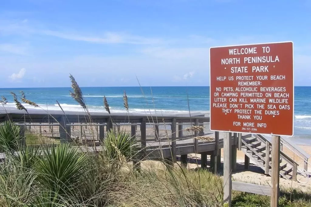flagler fl, North Peninsula State Park Beach Walkway and Entrance sign